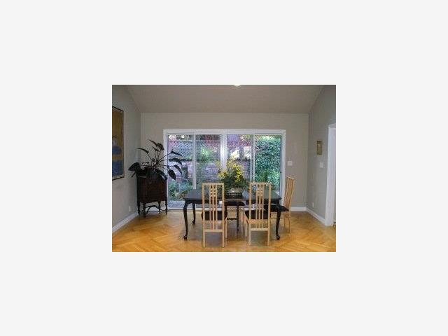 757 Edgewood Road San Mateo, CA 94402 - Photo 4 of 9 a view of a dining room with furniture and floor to ceiling window