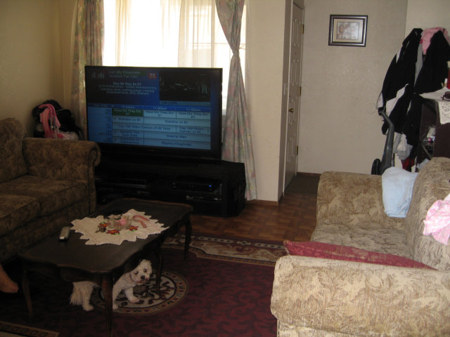 14203 Overpass Road Watsonville, CA 95076 - Photo 3 of 9 a living room with furniture and a flat screen tv