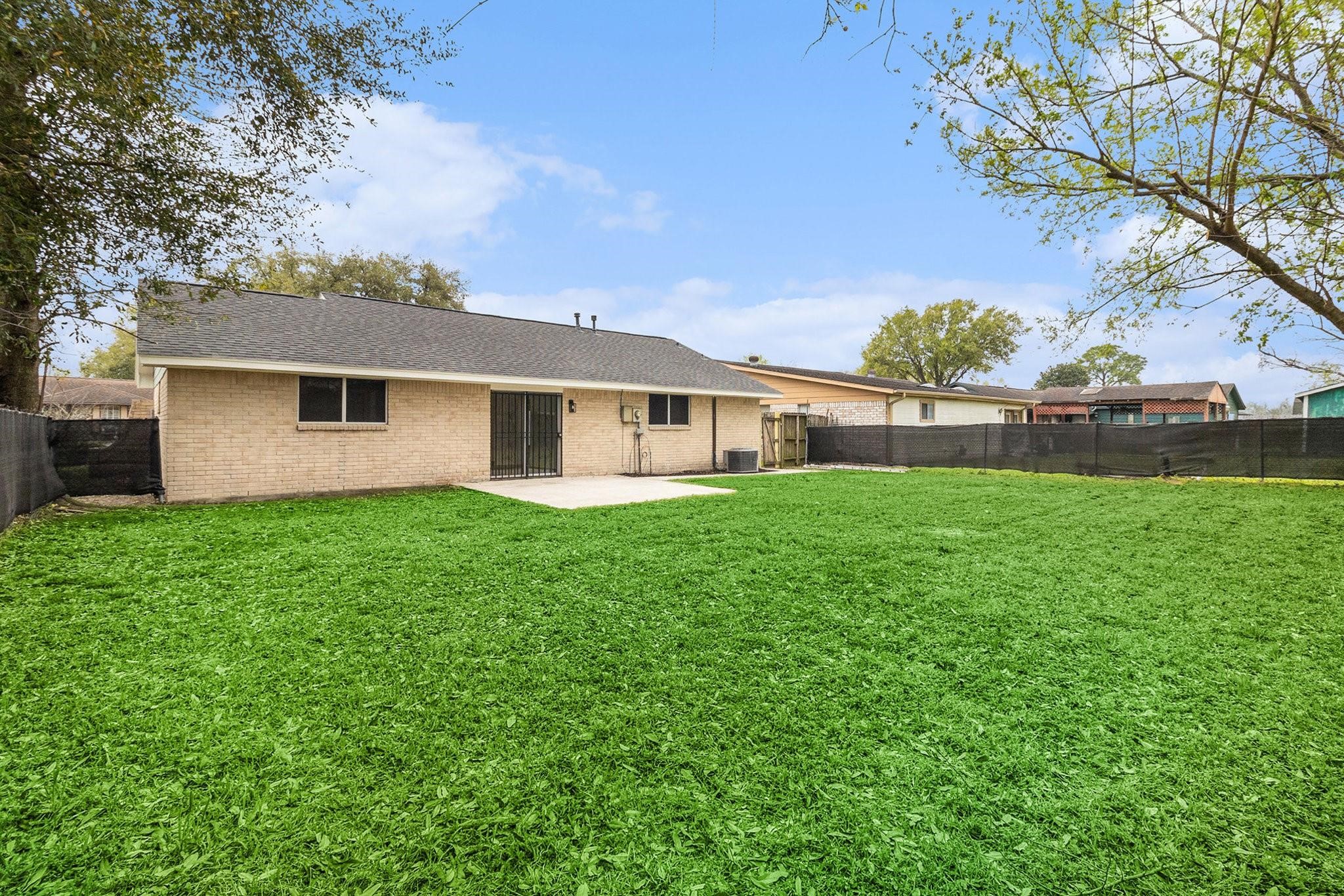 1510 Tarberry Road Houston, TX 77088 - Photo 18 of 19 a front view of house with yard and green space
