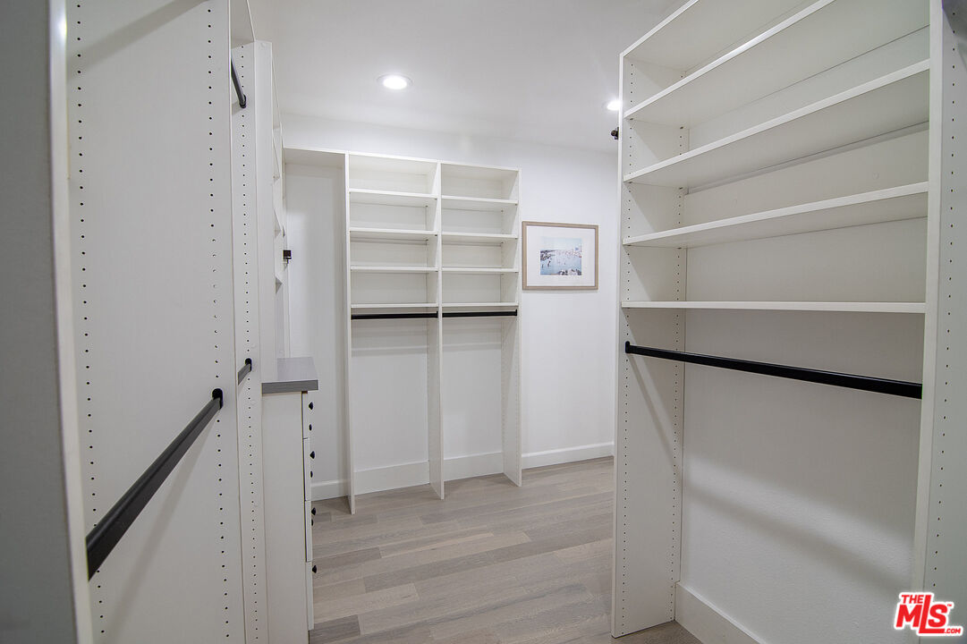 1887 Greenfield Avenue, Unit 110 Los Angeles, CA 90025 - Photo 12 of 18 a view of walk in closet with empty racks