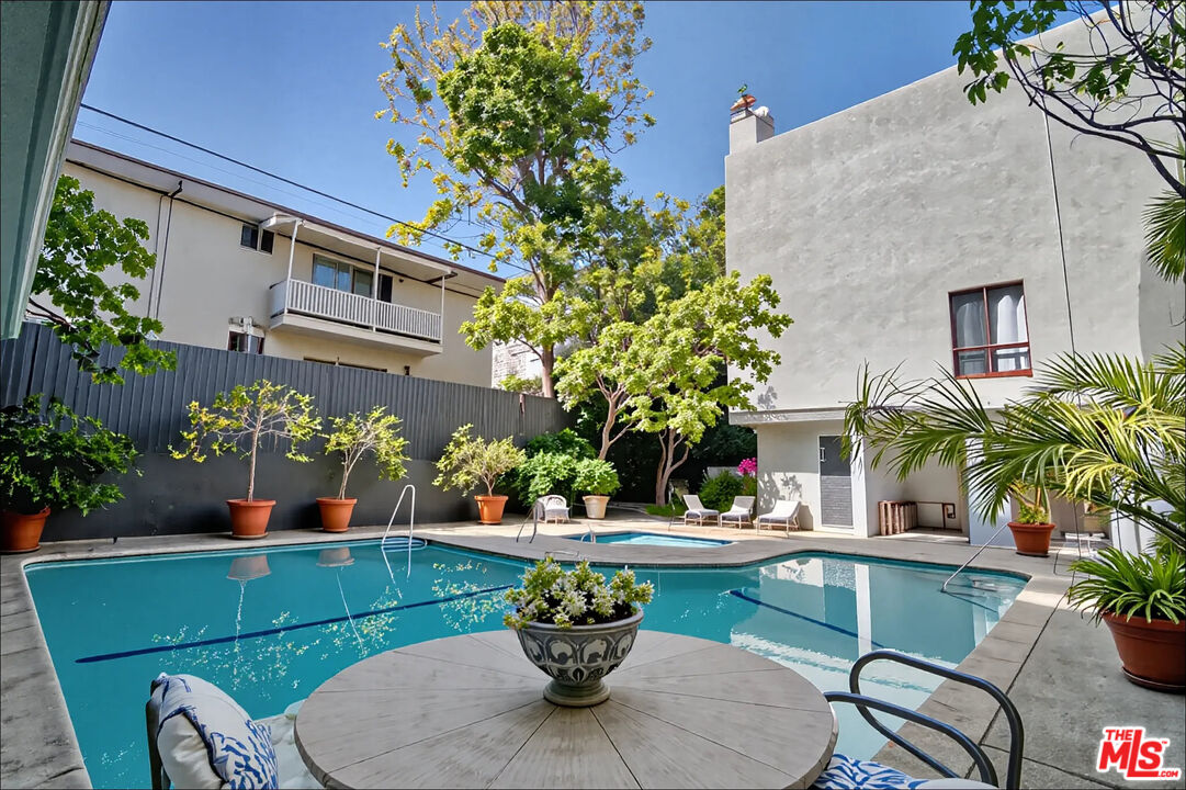 1887 Greenfield Avenue, Unit 110 Los Angeles, CA 90025 - Photo 17 of 18 a view of a chairs and table in a patio