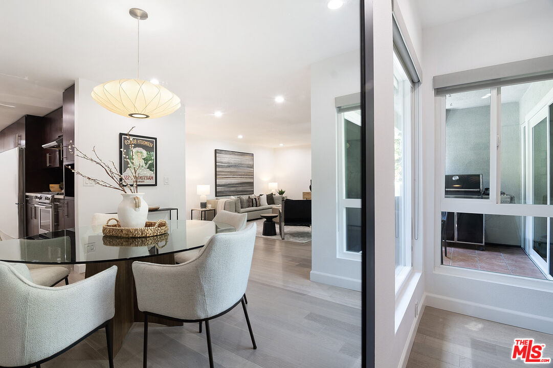1887 Greenfield Avenue, Unit 110 Los Angeles, CA 90025 - Photo 4 of 18 a living room with furniture and a fireplace