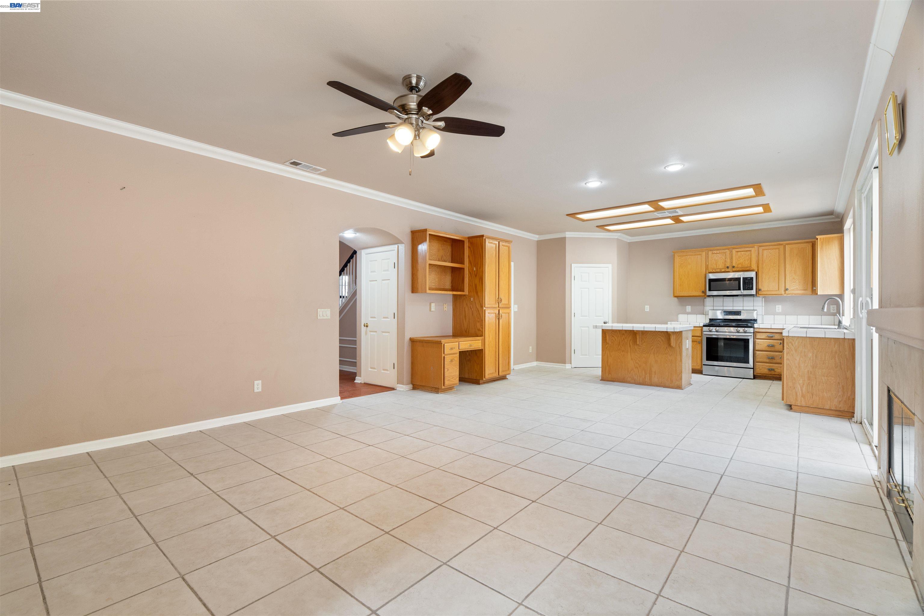 4925 Bay View Circle Stockton, CA 95219 - Photo 12 of 47 a view of a livingroom with furniture an empty room wooden floor and window