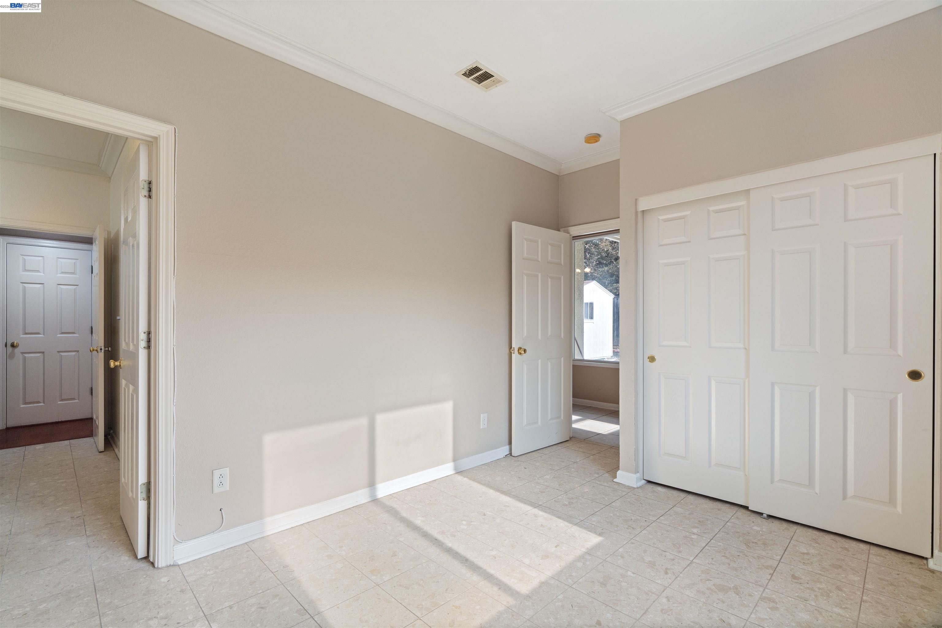 4925 Bay View Circle Stockton, CA 95219 - Photo 15 of 47 an empty room with closet and a bathroom