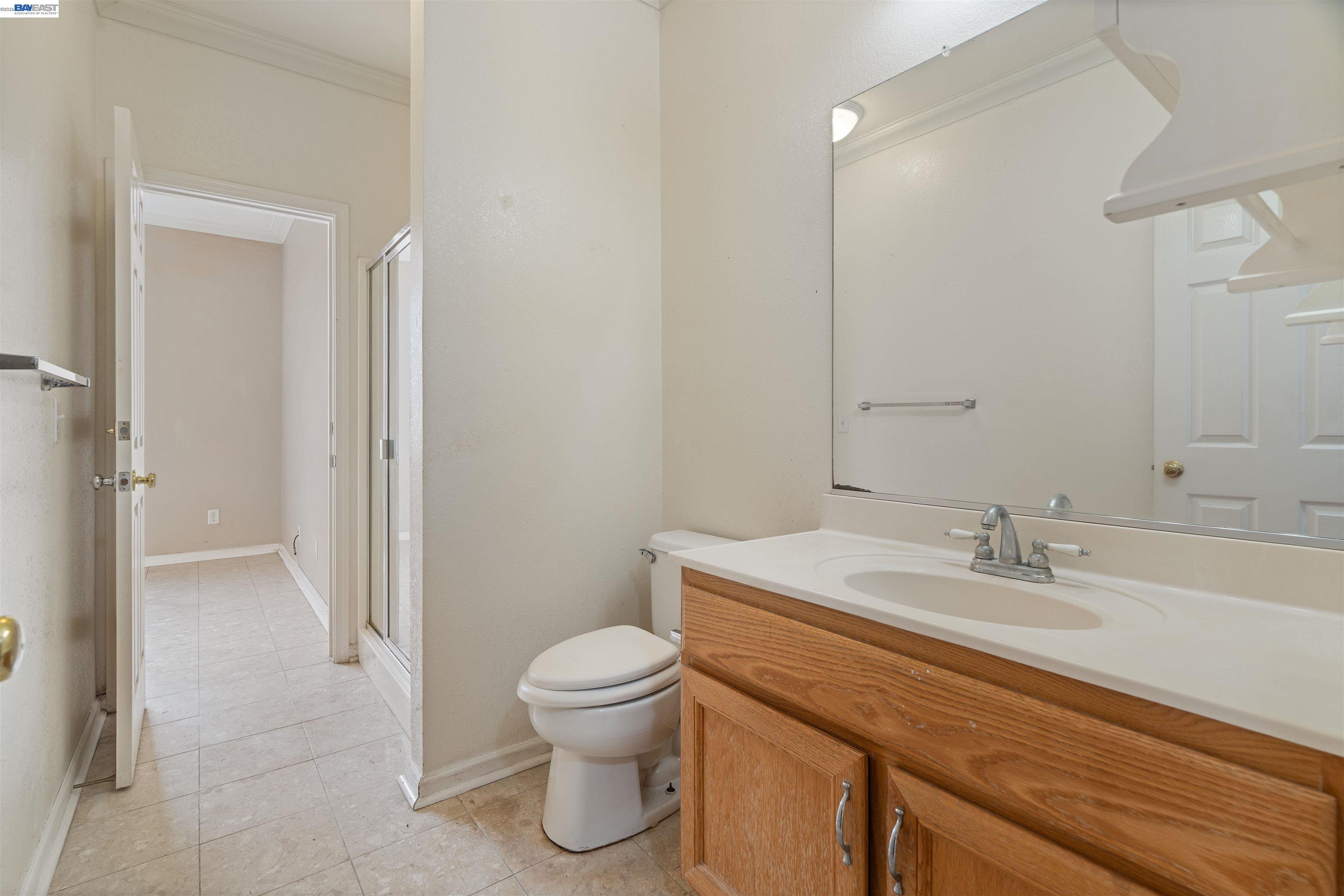 4925 Bay View Circle Stockton, CA 95219 - Photo 17 of 47 a bathroom with a sink a toilet and shower