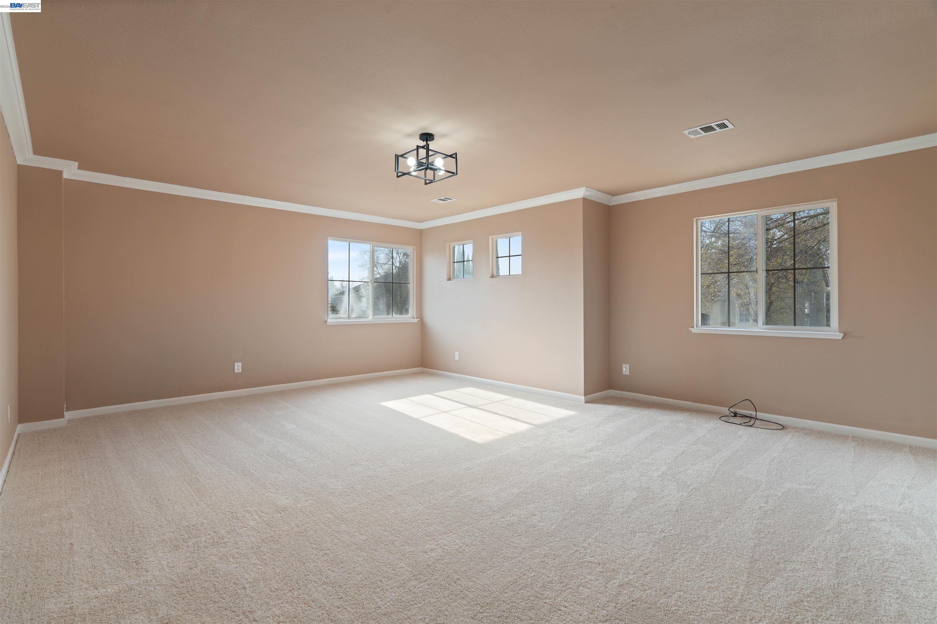 4925 Bay View Circle Stockton, CA 95219 - Photo 18 of 47 a view of an empty room with a window
