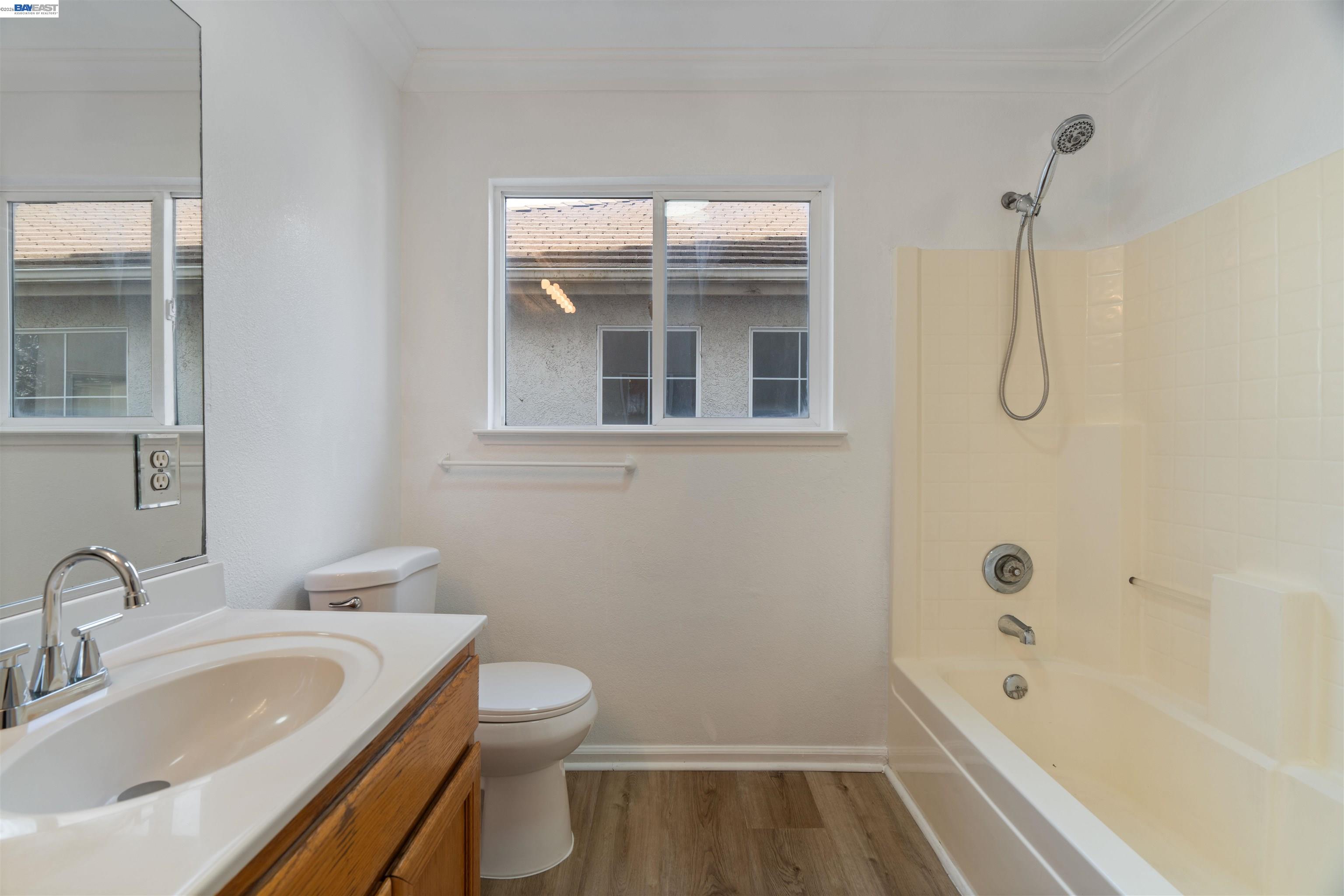 4925 Bay View Circle Stockton, CA 95219 - Photo 25 of 47 a bathroom with a granite countertop sink a toilet and shower