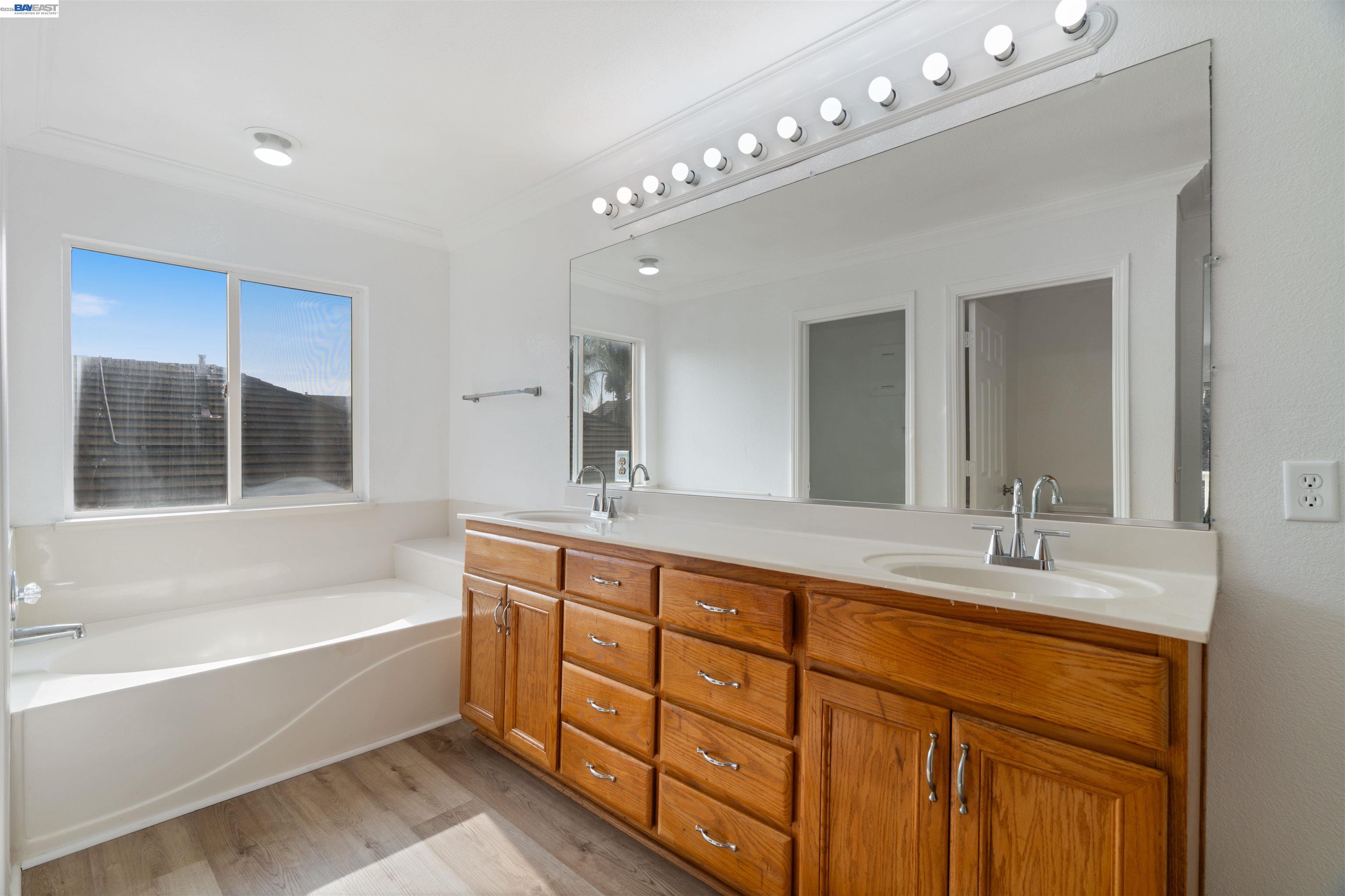 4925 Bay View Circle Stockton, CA 95219 - Photo 31 of 47 a spacious bathroom with sinks mirror and a bathtub