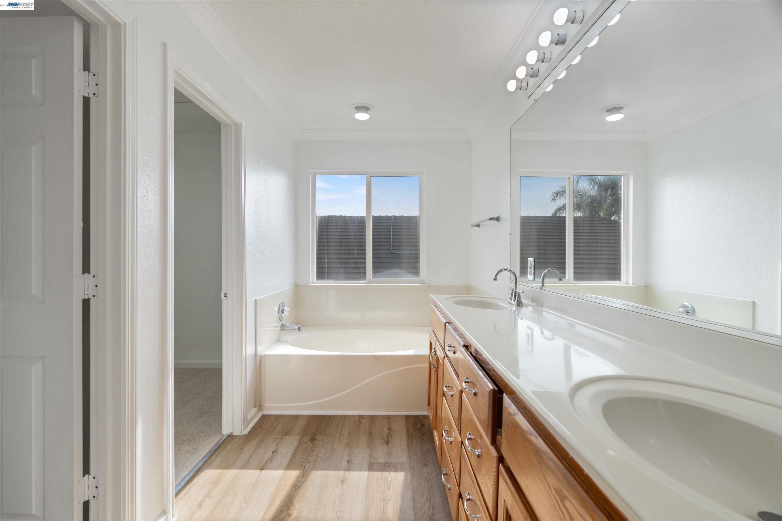 4925 Bay View Circle Stockton, CA 95219 - Photo 32 of 47 a bathroom with a tub sink and mirror