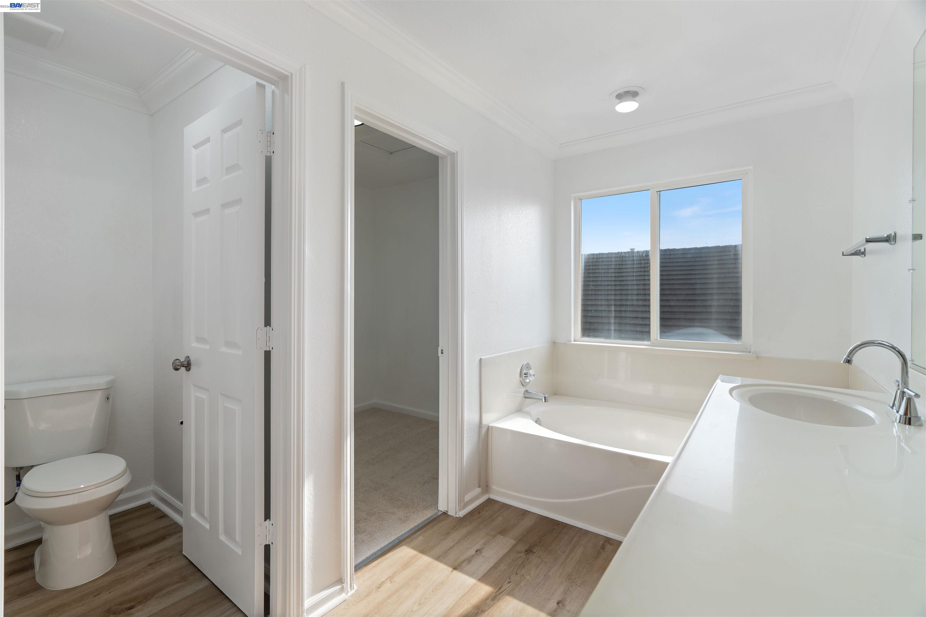 4925 Bay View Circle Stockton, CA 95219 - Photo 33 of 47 a bathroom with a toilet and a bathtub