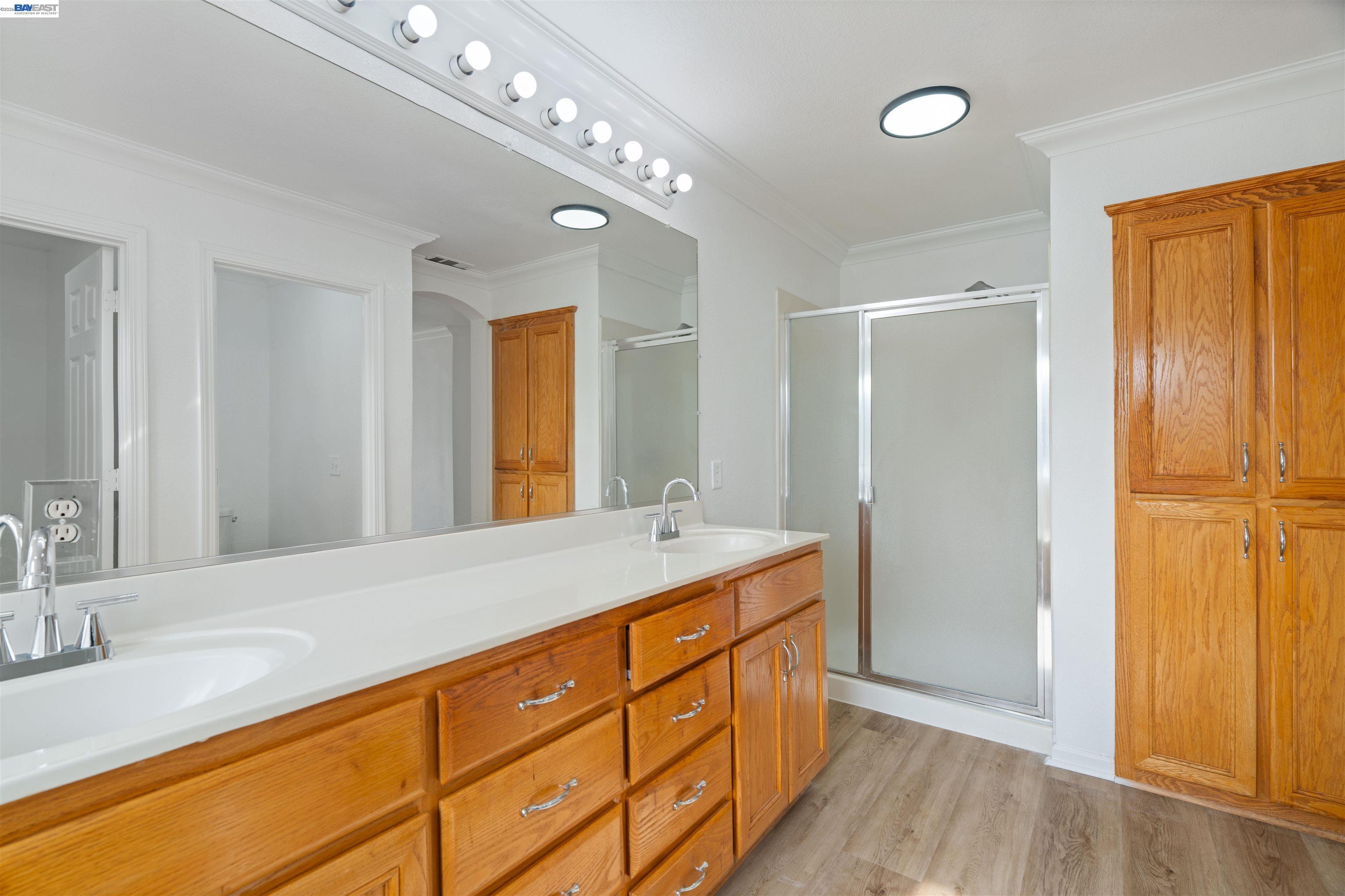 4925 Bay View Circle Stockton, CA 95219 - Photo 34 of 47 a spacious bathroom with a double vanity sink and a mirror