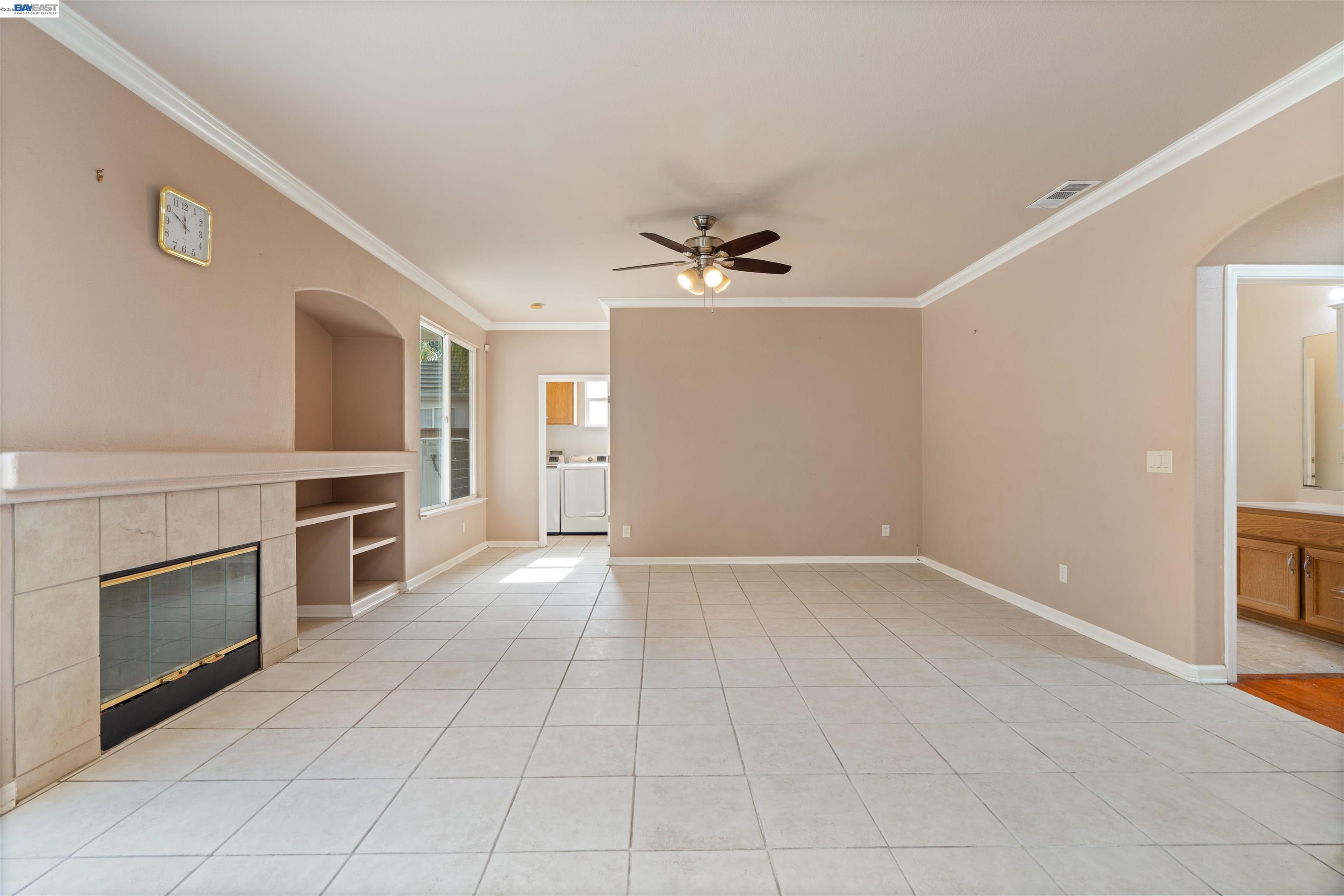 4925 Bay View Circle Stockton, CA 95219 - Photo 9 of 47 an empty room with windows and fireplace