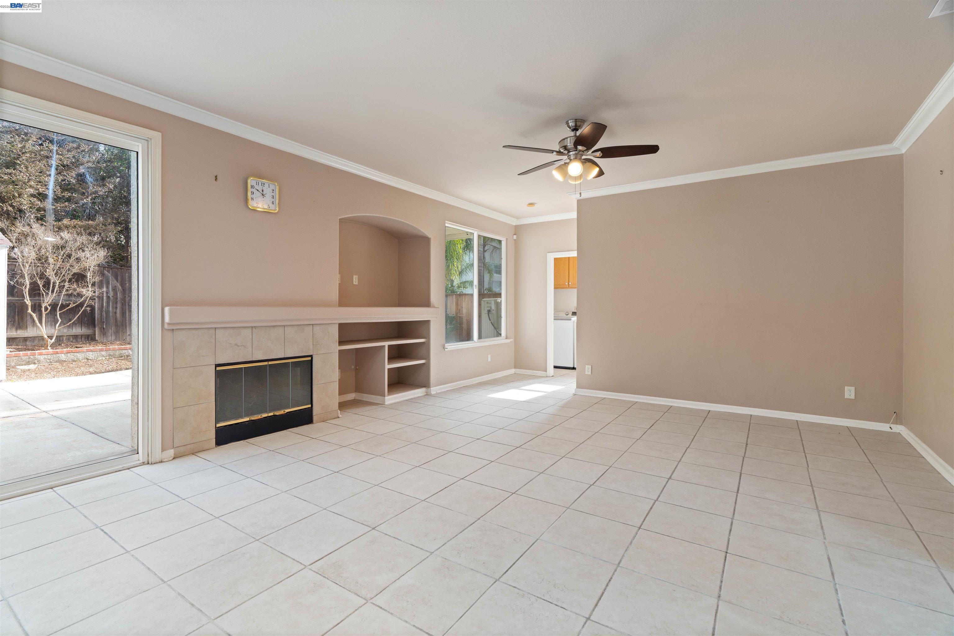 4925 Bay View Circle Stockton, CA 95219 - Photo 10 of 47 an empty room with fireplace and windows