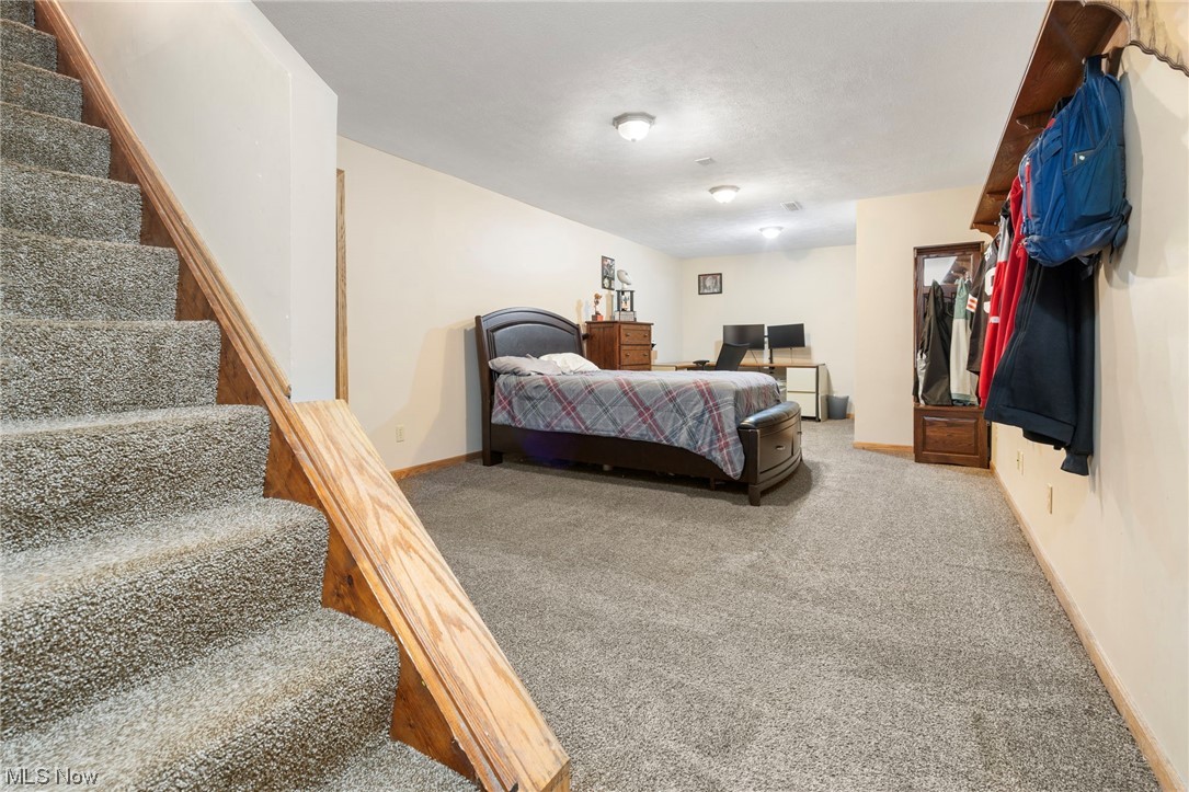 4915 Monticello Street Northwest Canton, OH 44708 - Photo 25 of 31 View of carpeted rec room in basement