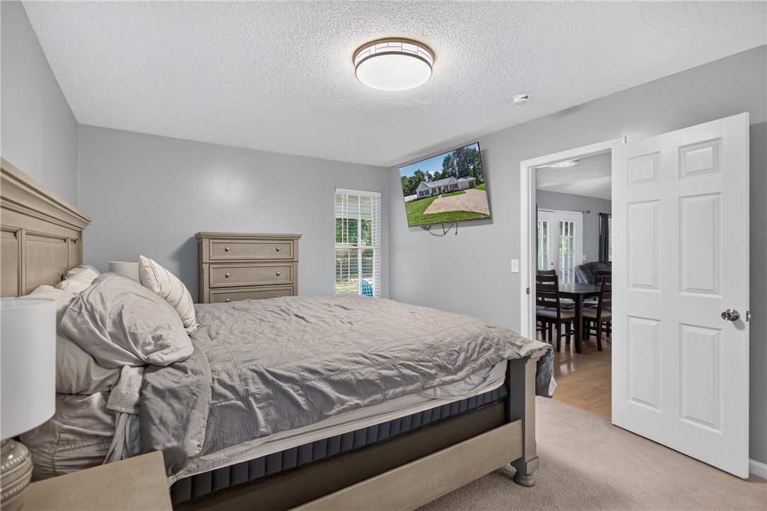 3336 Centerville Road Anderson, SC 29625 - Photo 23 of 50 A well-lit bedroom provides comfortable living and easy access to the adjacent dining space.