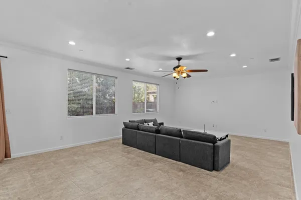a bedroom with bed and a potted plant