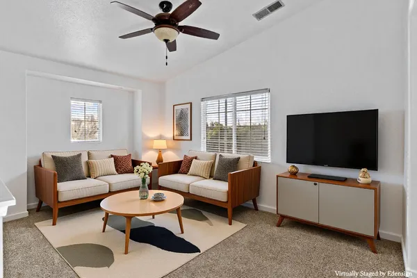 a spacious bathroom with a granite countertop sink a mirror and a shower