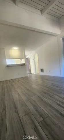 a room with gym equipment and a flat screen tv