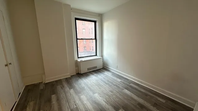 a view of an empty room and window