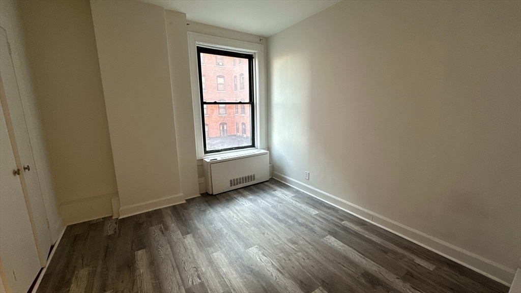 140 Chestnut Street, Unit 301 Springfield, MA 01103 - Photo 5 of 8 a view of an empty room and window