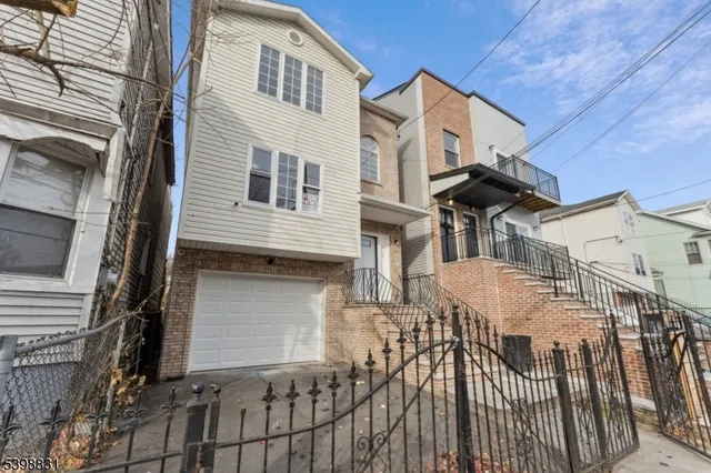 a front view of house along with street