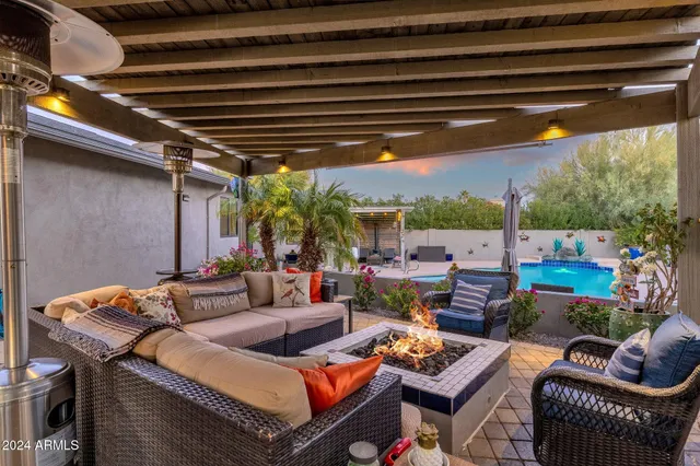 a outdoor living space with patio furniture and a potted plant