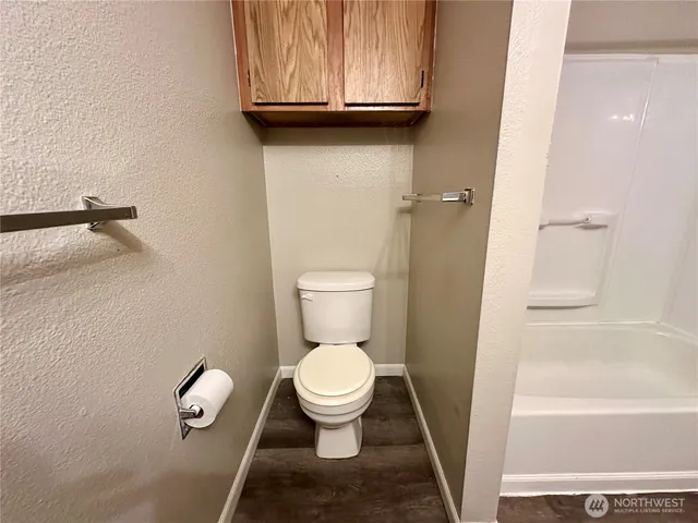 a balcony with wooden floor and outdoor space