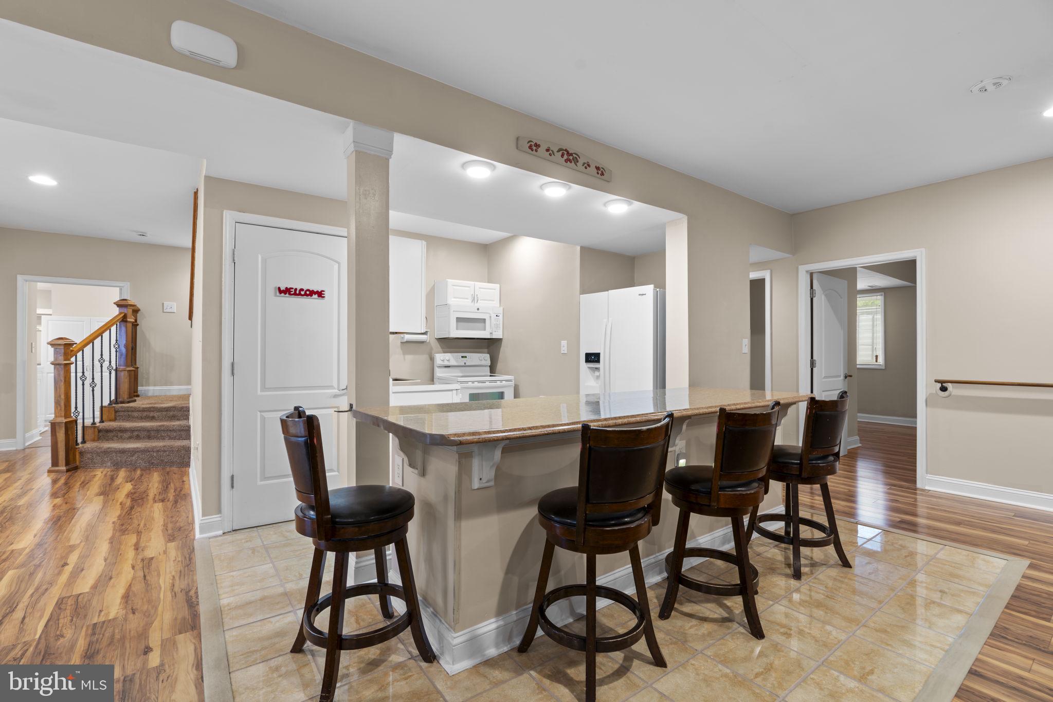 8024 Solley Road Glen Burnie, MD 21060 - Photo 58 of 83 a view of a dining room with furniture and wooden floor