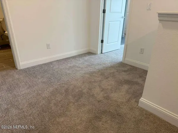 an empty room with an entryway