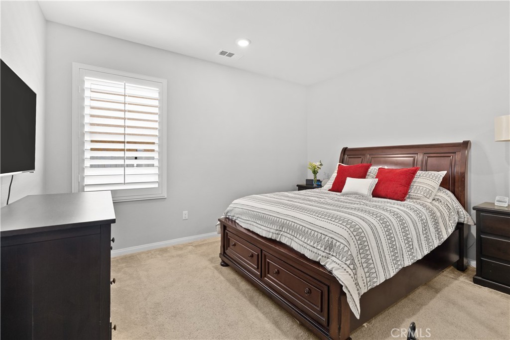 20948 Center Street Riverside, CA 92507 - Photo 35 of 92 a bedroom with a bed and a desk