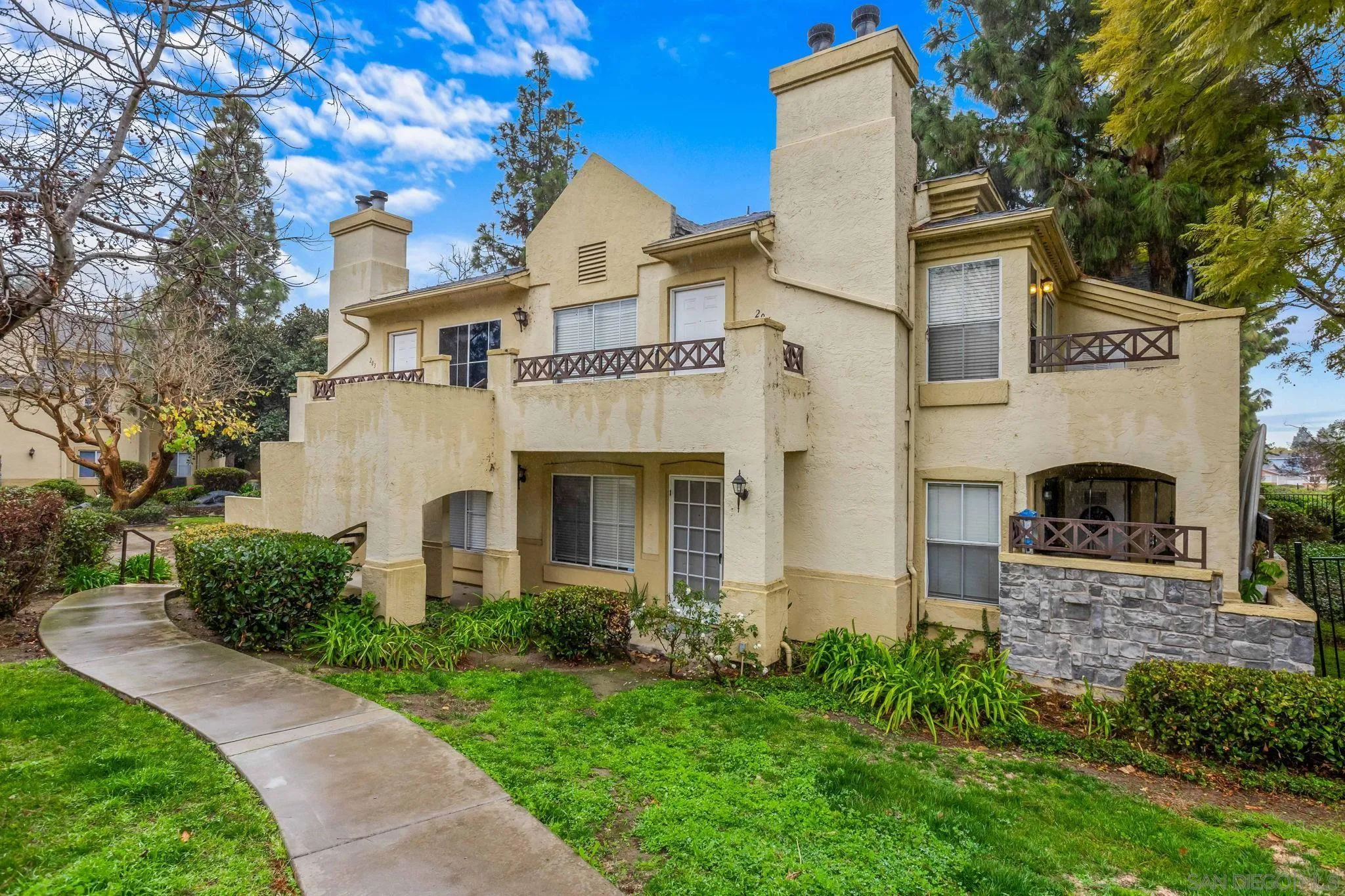 719 Brookstone Road, Unit 203 Chula Vista, CA 91913 - Photo 3 of 23 a front view of a house with garden
