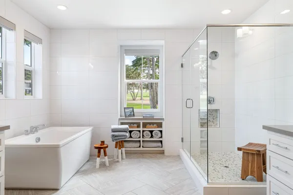 a view of a patio with a table and chairs under an umbrella
