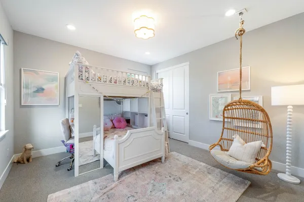 a front view of a house with a garden and porch