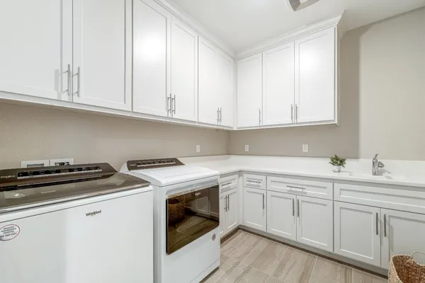 a dining room with furniture and a floor to ceiling window