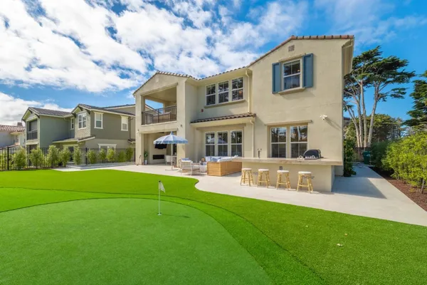 a patio with table and chairs