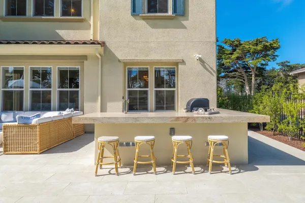 a front view of a building with a garden