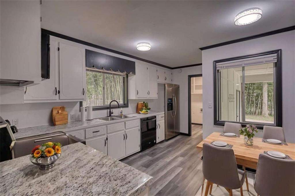 555 Joy Street Jackson, GA 30233 - Photo 21 of 56 a large kitchen with a table and chairs in it