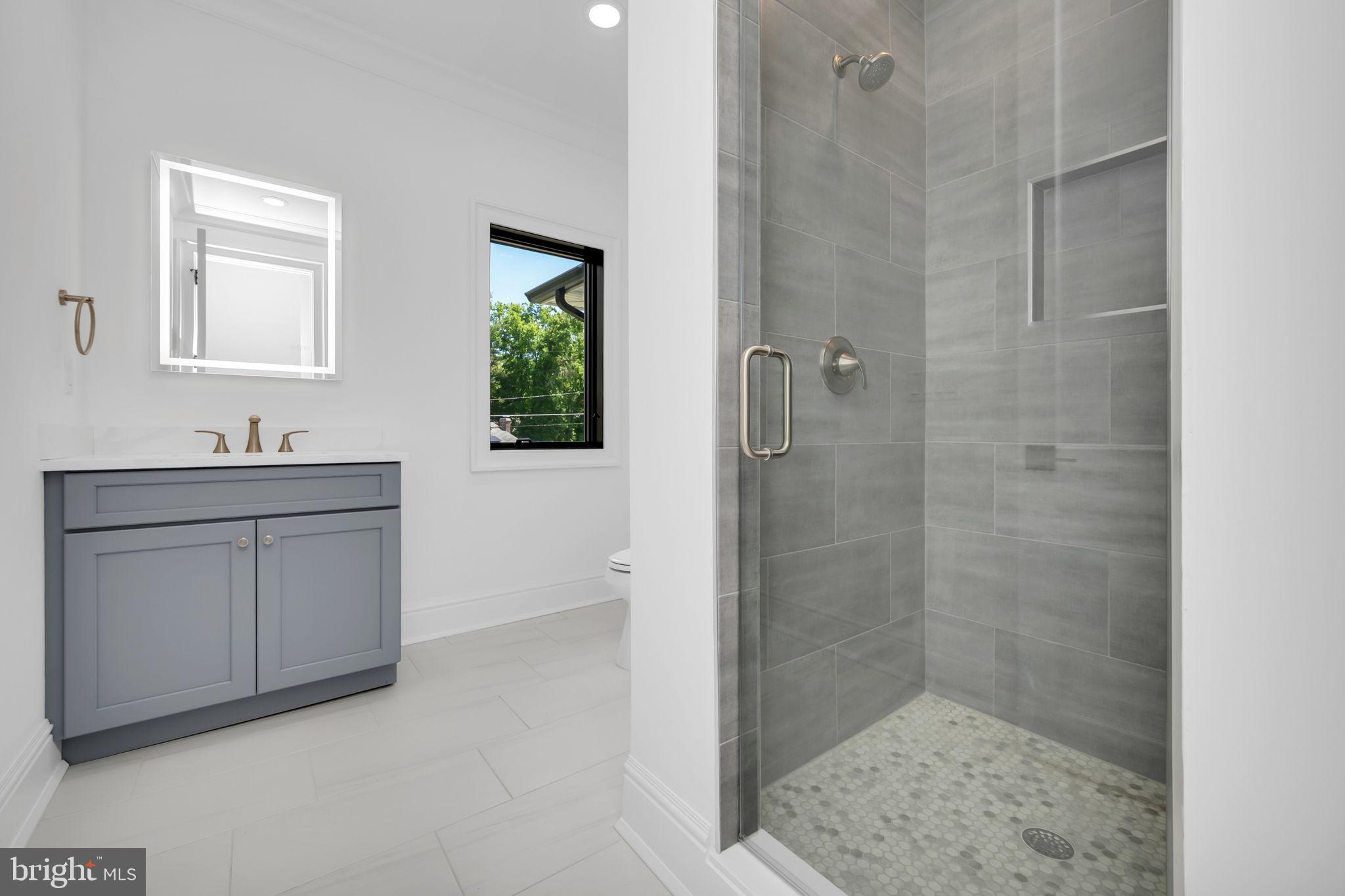32 Gulick Road Princeton, NJ 08540 - Photo 10 of 56 Sleek modern bathroom with natural light.
