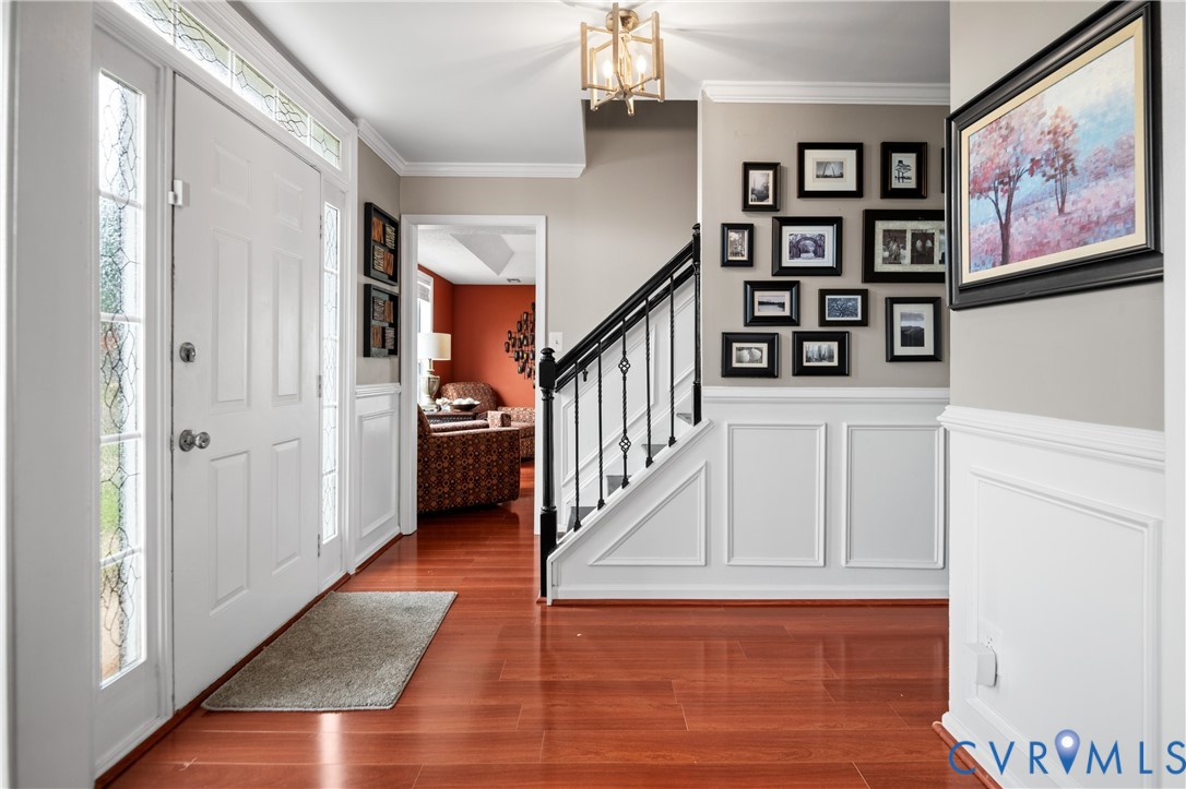 6356 Springcrest Lane Henrico, VA 23231 - Photo 14 of 43 a view of staircase with lots of frames on wall and a painting
