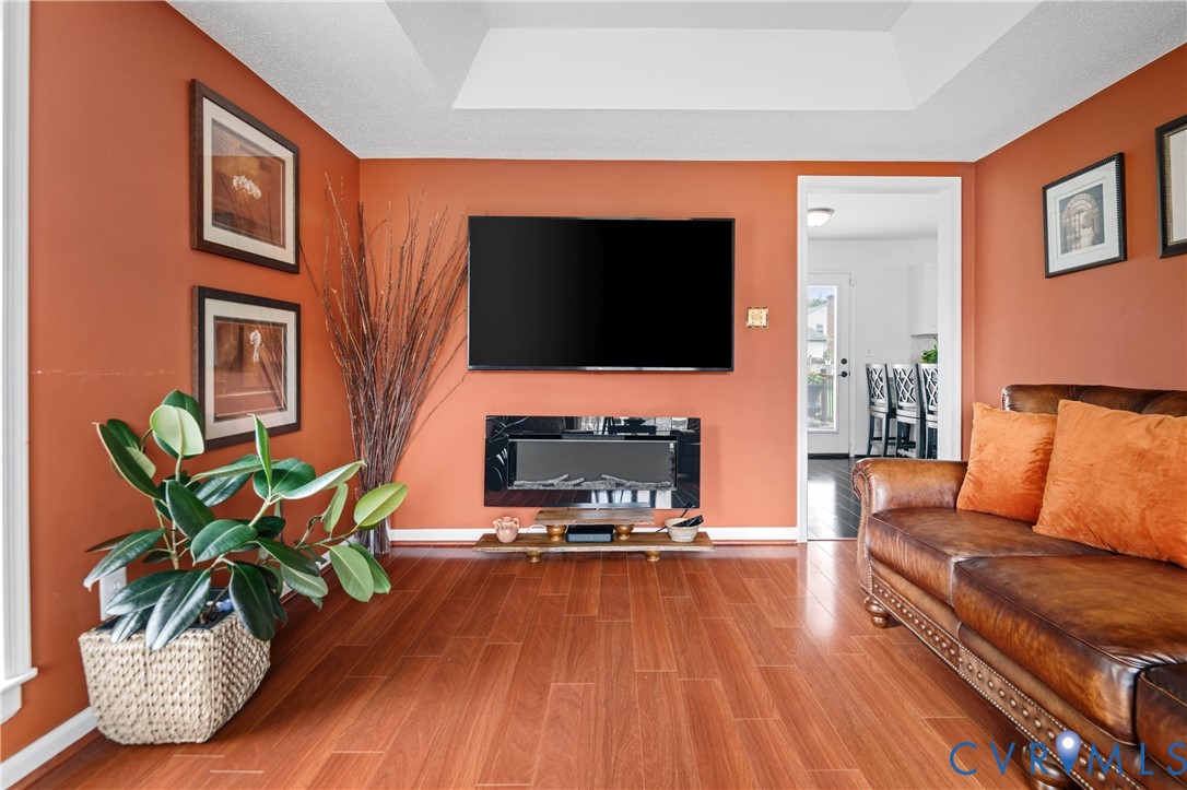 6356 Springcrest Lane Henrico, VA 23231 - Photo 16 of 43 a living room with furniture and a flat screen tv