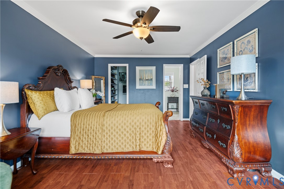 6356 Springcrest Lane Henrico, VA 23231 - Photo 19 of 43 a bed room with a bed and a chandelier