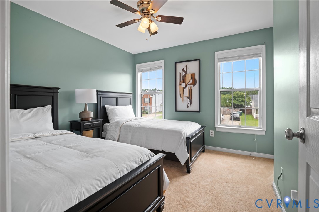 6356 Springcrest Lane Henrico, VA 23231 - Photo 26 of 43 a bedroom with two beds and a window
