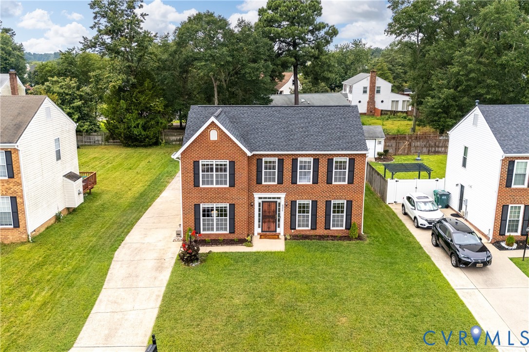 6356 Springcrest Lane Henrico, VA 23231 - Photo 34 of 43 a front view of a house with garden