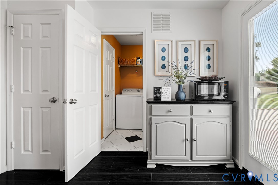 6356 Springcrest Lane Henrico, VA 23231 - Photo 7 of 43 a view of white cabinets and front door with wooden floor