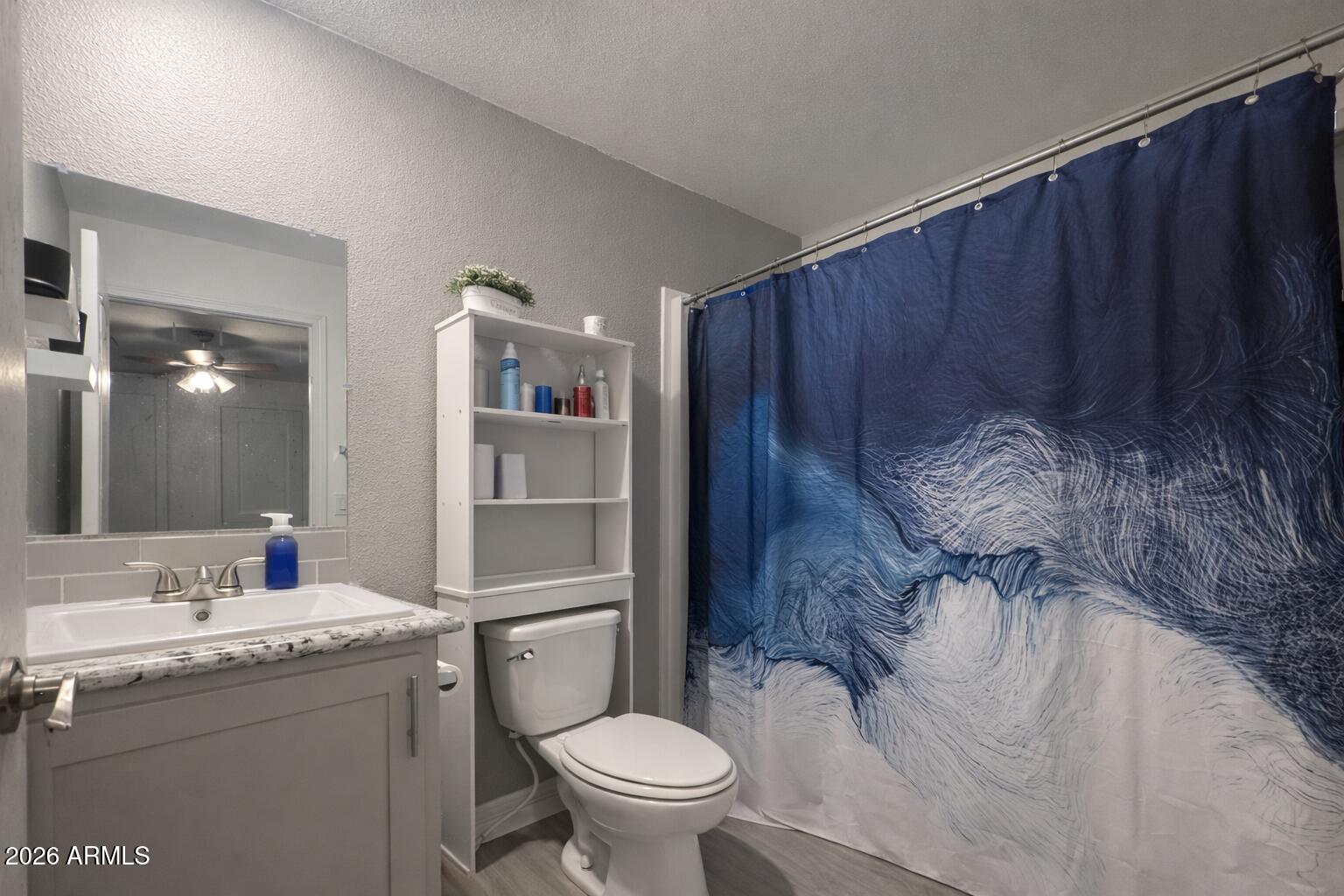 2046 South Mariposa Road Apache Junction, AZ 85119 - Photo 11 of 21 a bathroom with a toilet and a sink