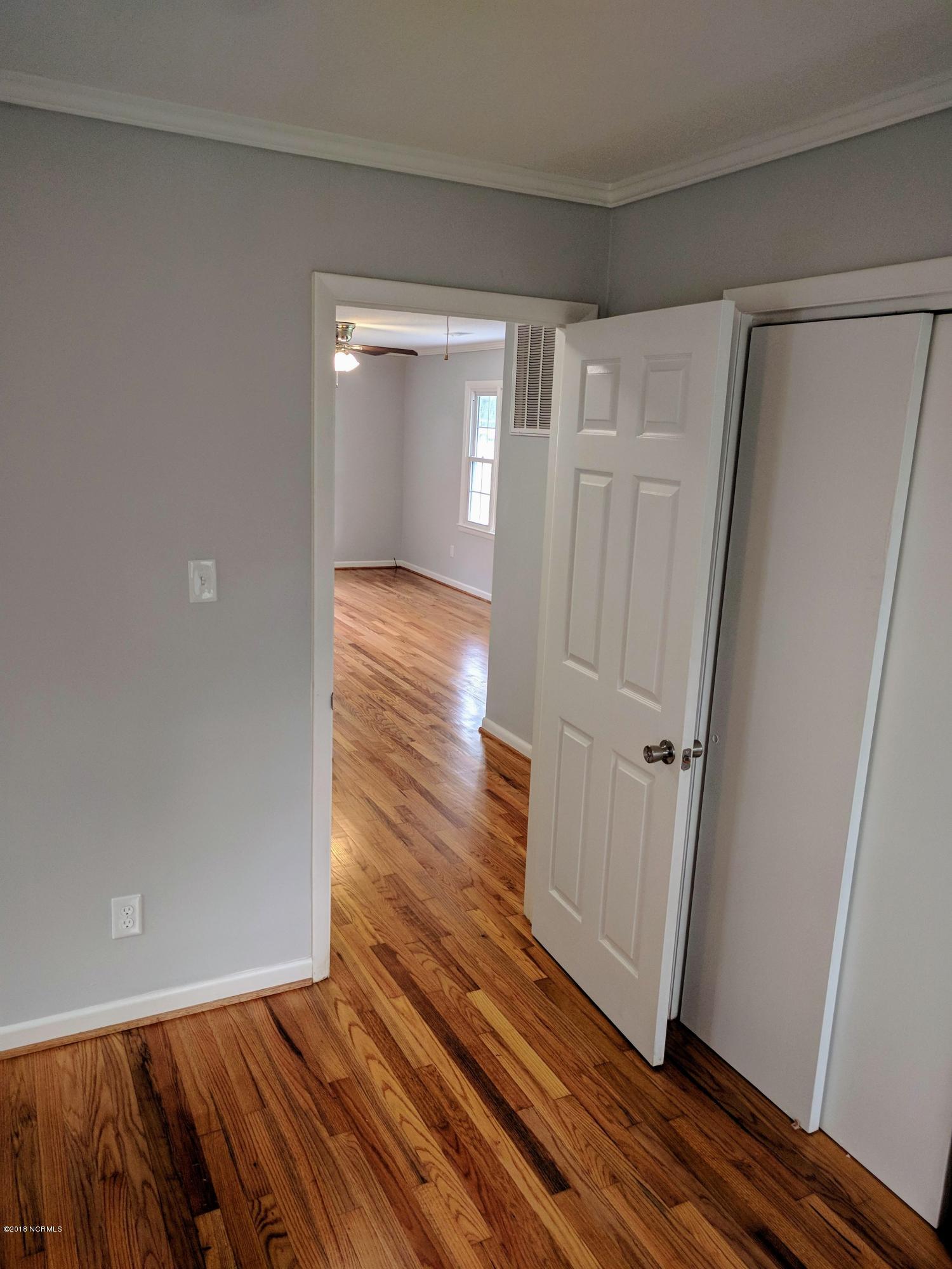 706 Tully Hill Road Kinston, NC 28504 - Photo 14 of 16 Looking from the rear bedroom to the living room.