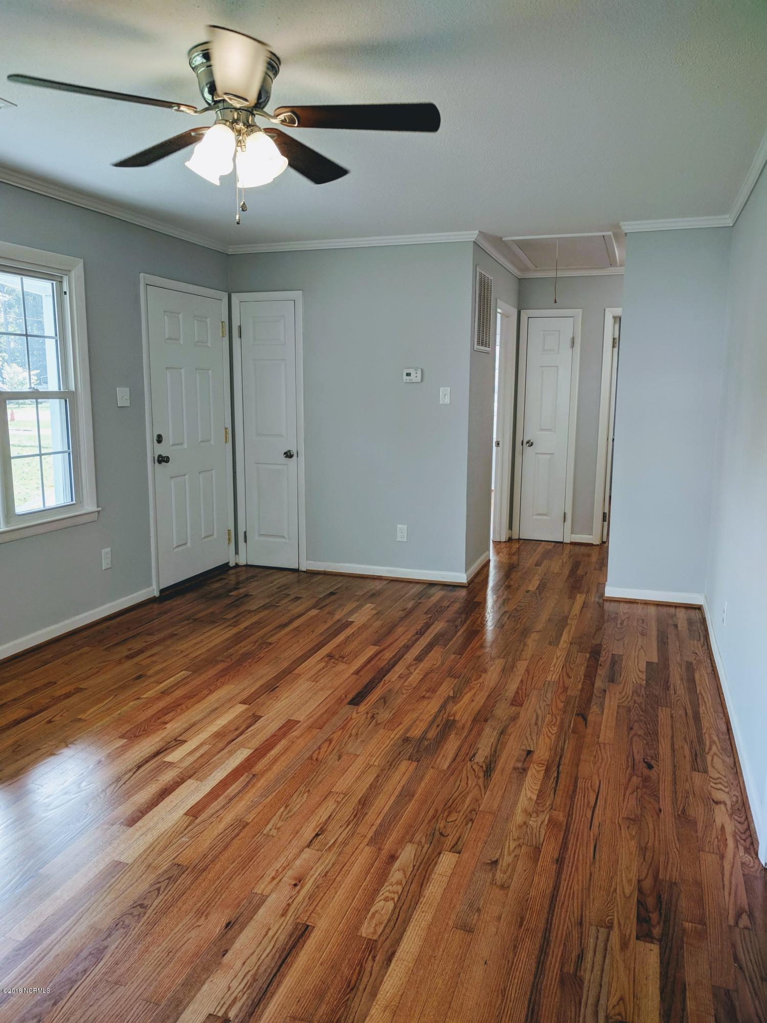 706 Tully Hill Road Kinston, NC 28504 - Photo 4 of 16 This is the living room. You can see the new exterior door and some of the brand new 6 panel doors throughout the house. Interior has been completely painted in Summer of 2018.