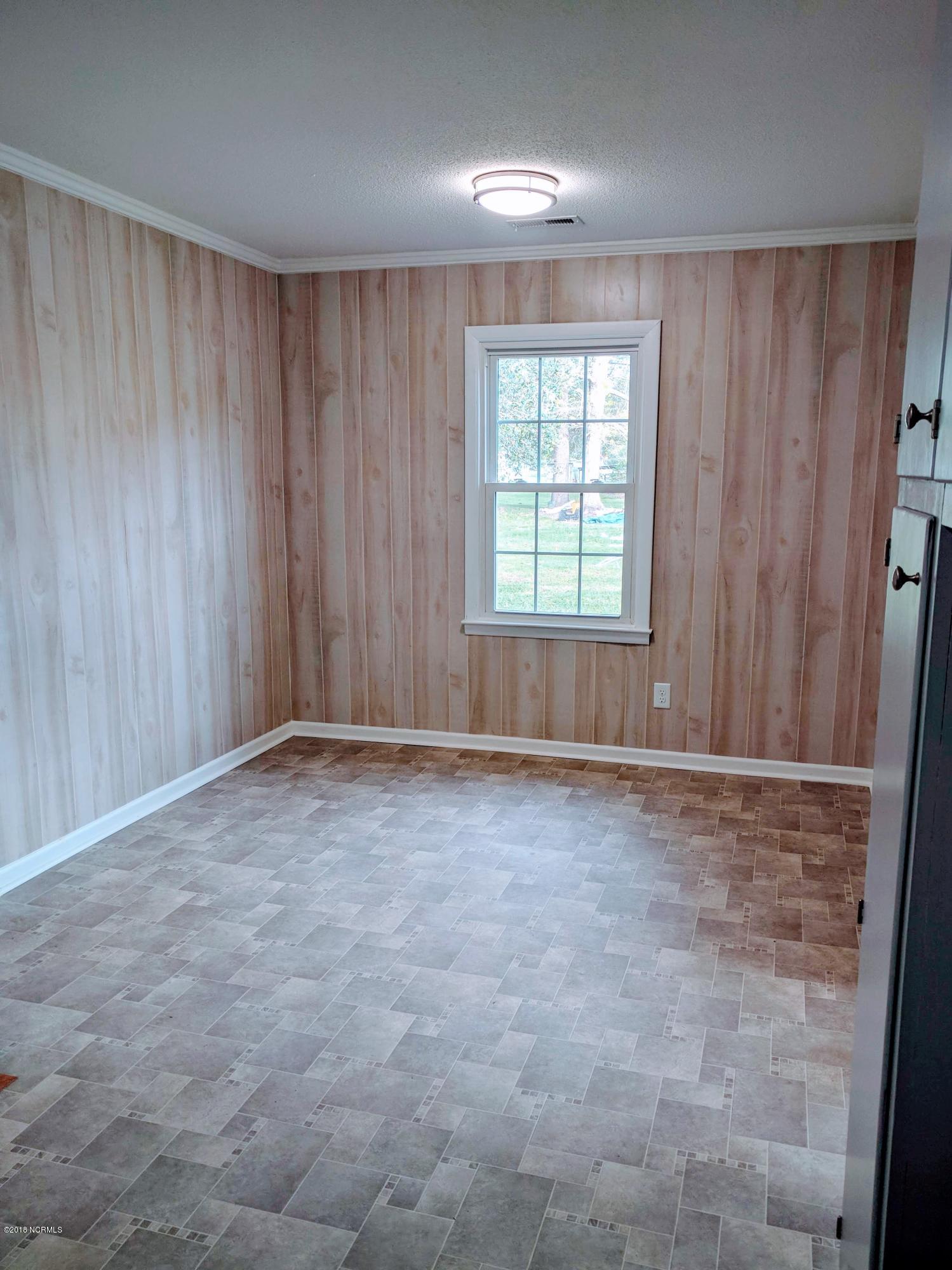 706 Tully Hill Road Kinston, NC 28504 - Photo 5 of 16 Kitchen/dining room combo. New flooring to match the bathroom.