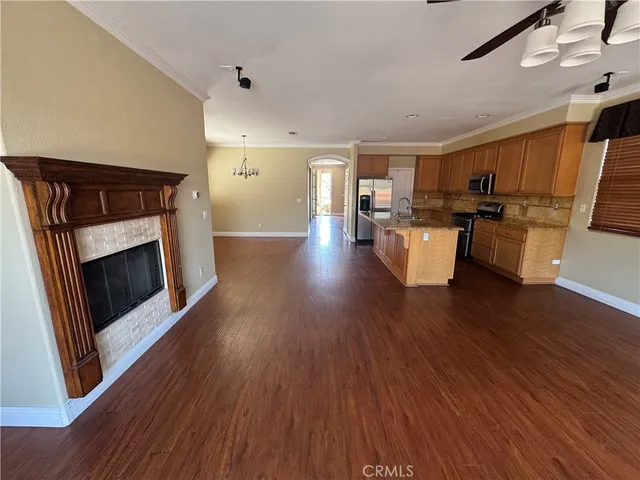 a open kitchen with sink cabinets and wooden floor
