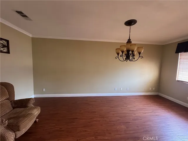 a view of room with window and ceiling fan